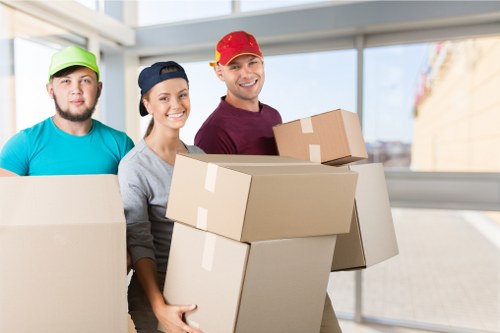 A professional moving team packing household items