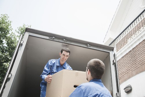 Professional movers loading items into a Van